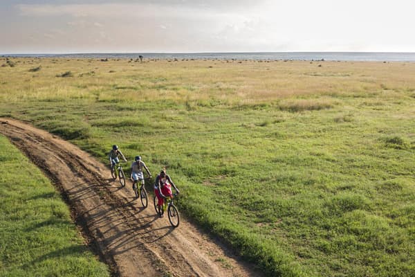 Tourists on a guided bike ride in Loisaba