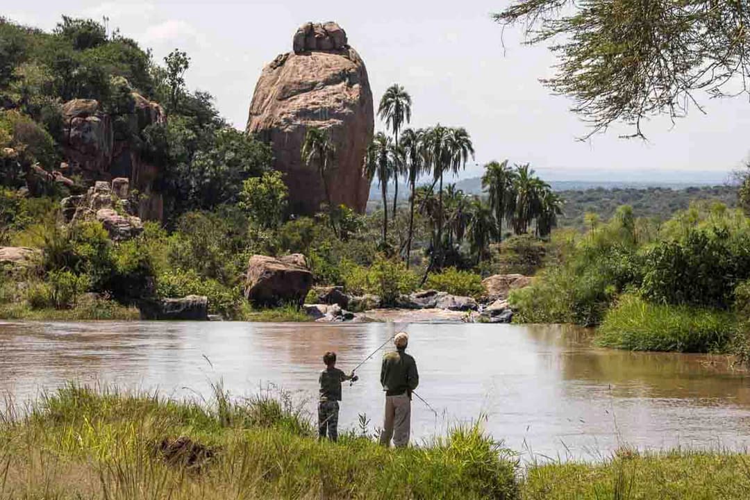 People fishing in a river